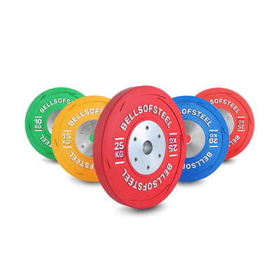 A set of colorful weightlifting plates labeled "BELLSOFSTEEL" in green (10kg), yellow (15kg), red (25kg), and blue (20kg) arranged standing on a white background.