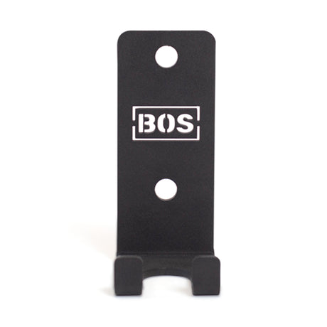 Bells of Steel Hanging Barbell Holders: black metal wall hooks with two mounting holes, designed for secure barbell storage. "BOS" logo in a white rectangle on the front, shown against a white background.