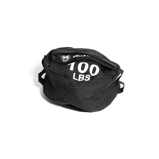 A Bells of Steel Fitness Sandbag, black with handles and "100 LBS" in white lettering, is displayed on a white background. Built from durable Condura fabric, it's perfect for intense sandbag workouts.