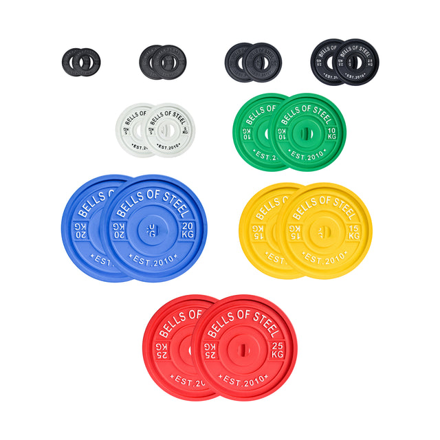 Bells of Steel's Calibrated Powerlifting Plates - KG Sets feature vibrant, IPF-spec weight plates from small black to larger white, blue, yellow, green, and red. Each plate is labeled with distinct weight denominations for the perfect powerlifting setup.
