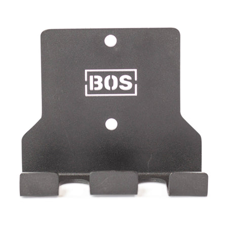 The Bells of Steel Hanging Barbell Holders are black metal, wall-mounted hooks with three prongs and two mounting holes, featuring a white "BOS" logo—perfect for secure barbell storage in your lifting space.