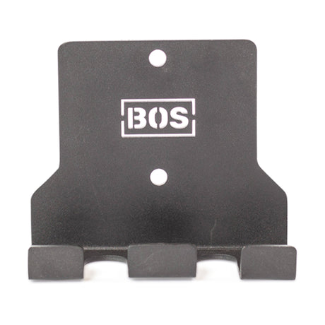 The Bells of Steel Hanging Barbell Holders are black metal, wall-mounted hooks with three prongs and two mounting holes, featuring a white "BOS" logo—perfect for secure barbell storage in your lifting space.