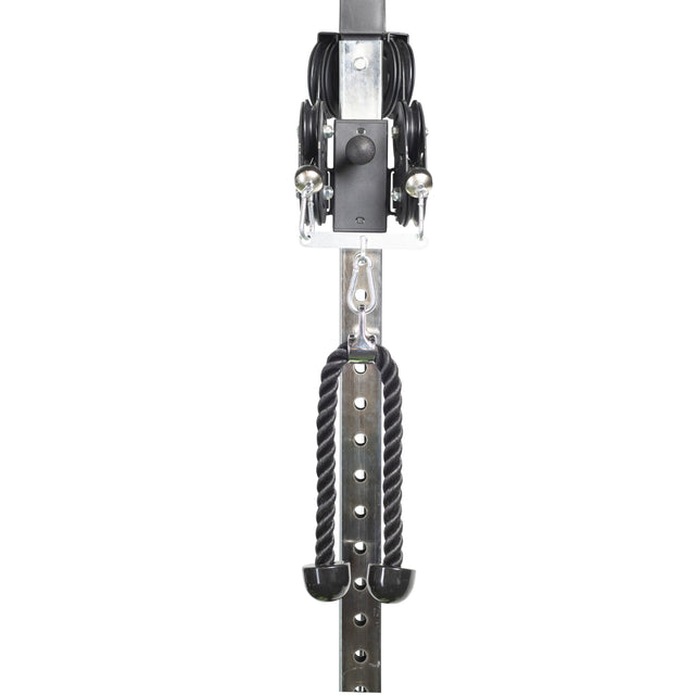 The Bells of Steel Tricep Rope Extension, a black cable machine attachment, hangs from a metal adjustable pulley system for gym or strength training exercises against a white background.