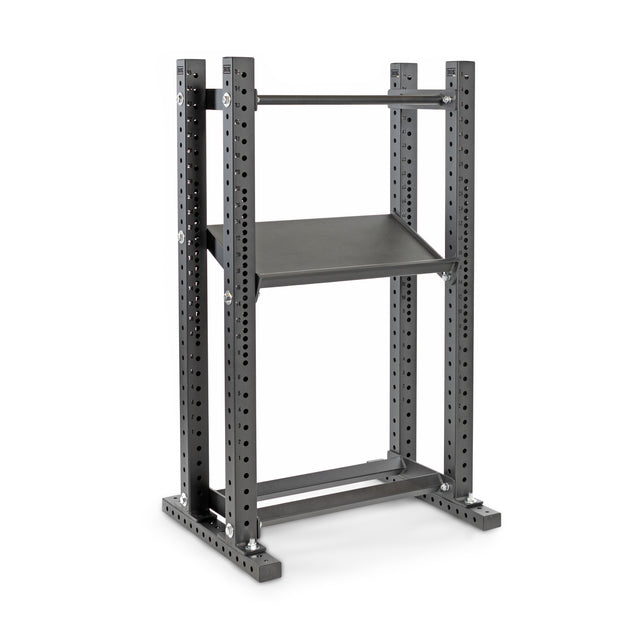 The Bells of Steel Hydra Flat Foot Components feature a sturdy metal frame with adjustable holes and a horizontal bar, perfect for gym or strength training. Its industrial gray finish and single middle shelf are supported by a flat foot system for enhanced stability.