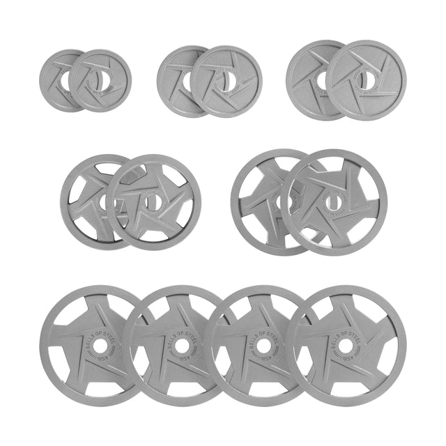 The Gray Mighty Grip Olympic Weight Plate Sets by Bells of Steel feature nine pairs with ergonomic rows, weight labels, and brand logos. The steel-colored plates have a star design at the center and are coated with durable hammertone powder for an enhanced finish.