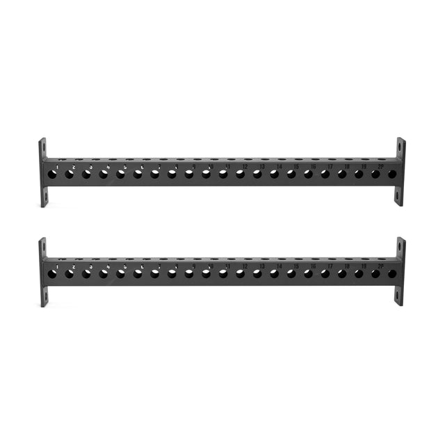 The Bells of Steel Manticore Crossmembers are black metal bars with evenly spaced holes and mounting plates, perfect for connecting Manticore Rack uprights or adding attachments—shown here against a white background.