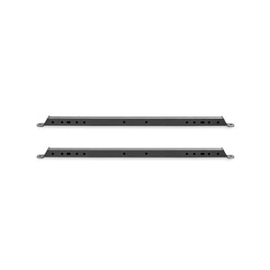 Two elongated black metal bars from Bells of Steel's Hydra Flat Foot Components are shown on a white background. Each bar, compatible with Hydra power racks, has circular holes throughout and mounting holes at both ends for integration into a flat foot support system.