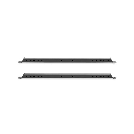 Two elongated black metal bars from Bells of Steel's Hydra Flat Foot Components are shown on a white background. Each bar, compatible with Hydra power racks, has circular holes throughout and mounting holes at both ends for integration into a flat foot support system.