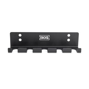 The Bells of Steel Hanging Barbell Holders is a black metal wall rack with six hooks, four screw holes for secure mounting, and a white BOS logo at the center—perfect for organizing your lifting space in style.