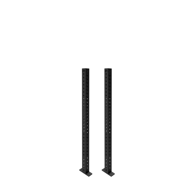 Two Bells of Steel Hydra Vertical Uprights, black with evenly spaced holes and wide base plates, stand side by side against a white background, designed for compatibility with various power rack attachments.