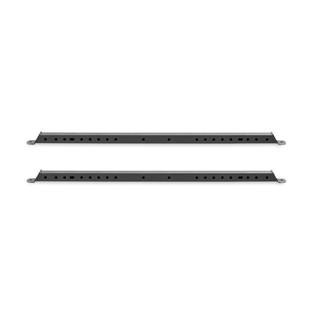 Against a white backdrop, two black Hydra Flat Foot Components by Bells of Steel are positioned horizontally, each featuring evenly spaced holes for rack or shelving system mounting.