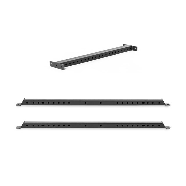 Two black metal Hydra Flat Foot Components by Bells of Steel, featuring multiple holes for power rack support, are shown from different angles on a white background.