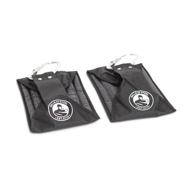 A pair of black fabric Hanging Ab Straps by Bells of Steel with padded inserts and metal carabiners are shown on a white background—perfect for arm support during core workouts.
