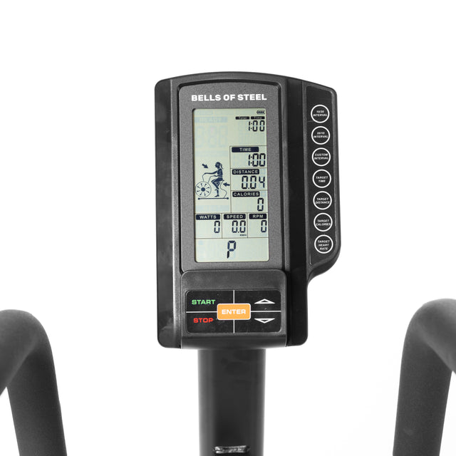 A close-up of the Bells of Steel Residential Air Bike with Wind Guard digital screen in your home gym shows workout data like time, speed, distance, and calories. The bike includes Start, Stop, and Enter buttons for easy navigation.