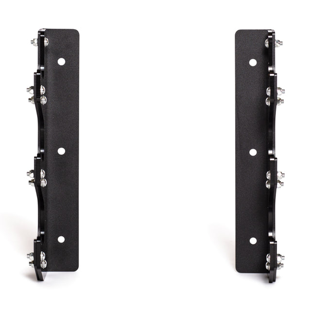 The Bells of Steel 3 Barbell Wall Rack features two upright, parallel black metal brackets with HDPE plastic lining, designed for securely mounting and holding barbells on the wall.
