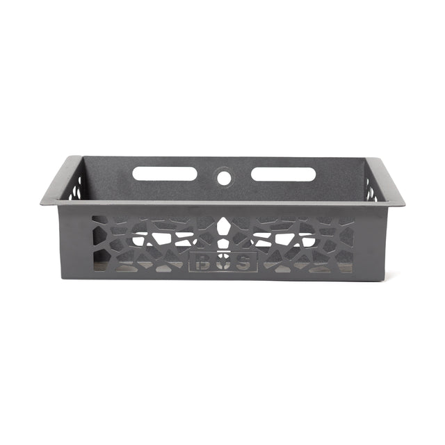 The Bells of Steel Rack Attached Storage Basket is a rectangular black metal basket with decorative cutouts, two horizontal slots, a round hole on the back, and a front center logo—ideal for gym storage.
