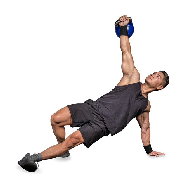 A man in black athletic wear and gray sneakers does a side plank, holding a blue kettlebell overhead while wearing Bells of Steel BellGuard Kettlebell Wrist Guards, against a white background.
