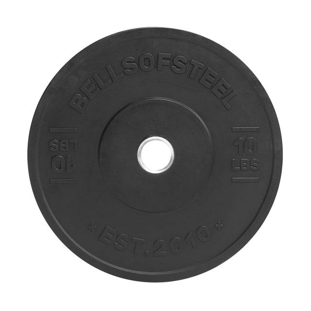 The Bells of Steel All-Black Bumper Plate is a 10-lb black plate with "BELLSOFSTEEL," "10 LBS," and "EST. 2010" embossed, made from medium-bounce rubber with a stainless steel insert and large center hole for easy barbell loading.