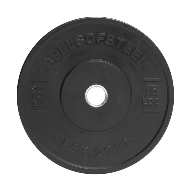 An All-Black Bumper Plate (15 lbs) by Bells of Steel with a stainless steel ring and "BELLSOFSTEEL," "15 LBS," and "EST. 2010" molded in medium-bounce rubber, seen from above.