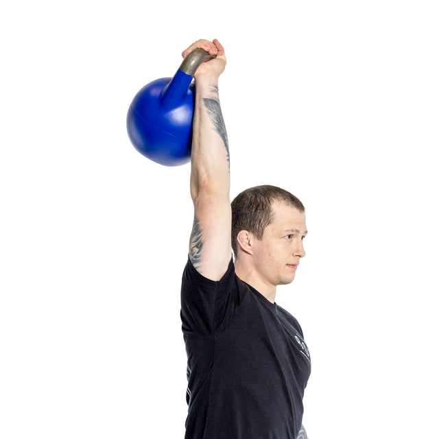 A person in a black T-shirt lifts a Bells of Steel Adjustable Competition Kettlebell overhead, highlighting fitness and strength. The plain white background emphasizes the exercise's focus and the kettlebell's potential for weight adjustments.