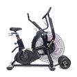 The Bells of Steel Blitz Max Air Bike, featuring a large front fan, dual handlebars, adjustable seat, and rear transport wheels, stands against a white background—ideal for commercial fitness settings.