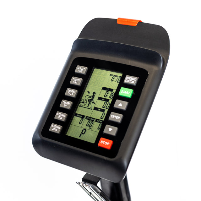 Close-up of the Bells of Steel Blitz Max Air Bike console featuring a green backlit display with workout stats, buttons for start/stop, enter, custom targets, and an orange clip—perfect for commercial gym setups.