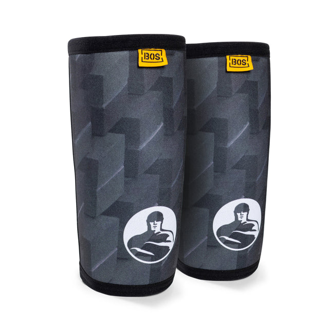 Bells of Steel Elbow Sleeves feature a black and grey pattern with a BOS logo at the top and a strongman graphic—perfect for added elbow support during tough workouts.