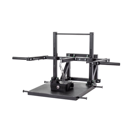 The Bells of Steel Belt Squat Machine is a black metal unit with a large platform, adjustable arms, and a chain with belt for lower body training at home. Shown against a white background.