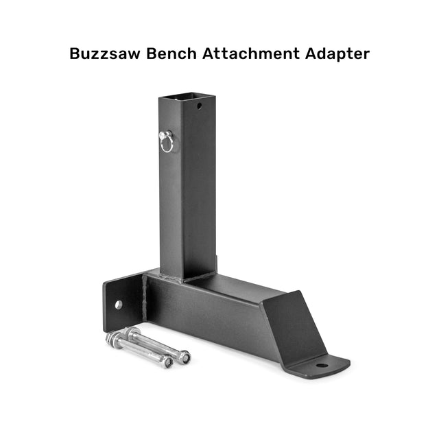 A black metal Bells of Steel Bench Attachments adapter with two bolts, shown on a white background. It features a vertical post, angled base, mounting holes, and is designed for bench add-ons like leg extension curl attachments.