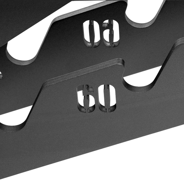 Close-up of a black metal weight rack with slots for organizing weights labeled "60" and "90," perfectly complementing the versatile exercise options provided by the Bells of Steel Buzz-Saw Heavy-Duty Adjustable Bench.