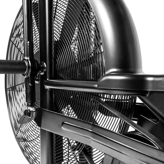 Close-up of the Bells of Steel Blitz Air Bike, showcasing its fan wheel, durable frame, and handlebars—ideal for full-body workouts in your home gym, all set against a clean white background.