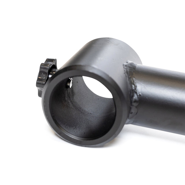 Close-up of a black metal tube from the Bells of Steel Camber Bar Attachment - Pair, showing a welded joint, round opening, and a textured screw knob on the side for tightening or adjusting.