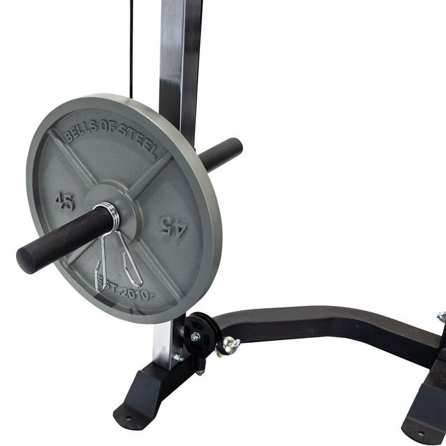 A close-up of a Bells of Steel 45 LB weight plate secured with a metal pin on a storage peg attached to the Cable Crossover (2.3" x 2.3" Racks) gym equipment.