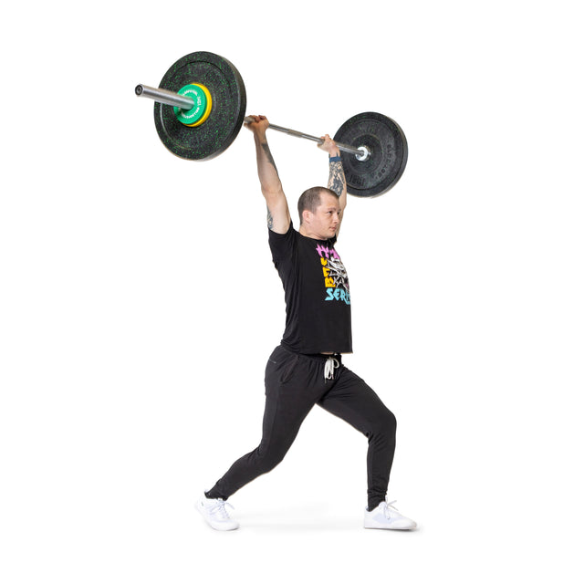 A man in black lifts a barbell overhead in a split stance against a white background, using Bells of Steel Urethane-Coated Change Plate Sets for reliable training performance.