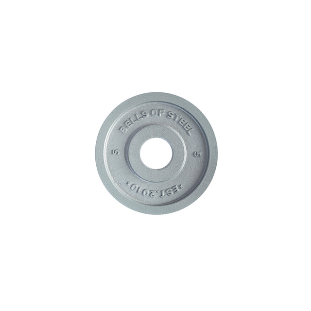 A Bells of Steel Machined Iron Olympic Weight Plate, silver with "BELLS OF STEEL," "EST. 2010," and "5" engraved, indicating 5 lbs. Features a precision hole fit and is displayed against a plain white background.