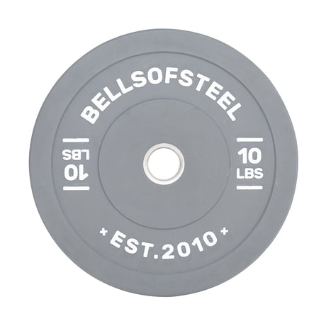 The Bells of Steel Colored Bumper Plates include a grey round design with "BELLSOFSTEEL" and "10 LBS" inscribed, plus "EST. 2010" at the bottom. Its stainless steel insert ensures accurate weight and a perfect fit on barbells.