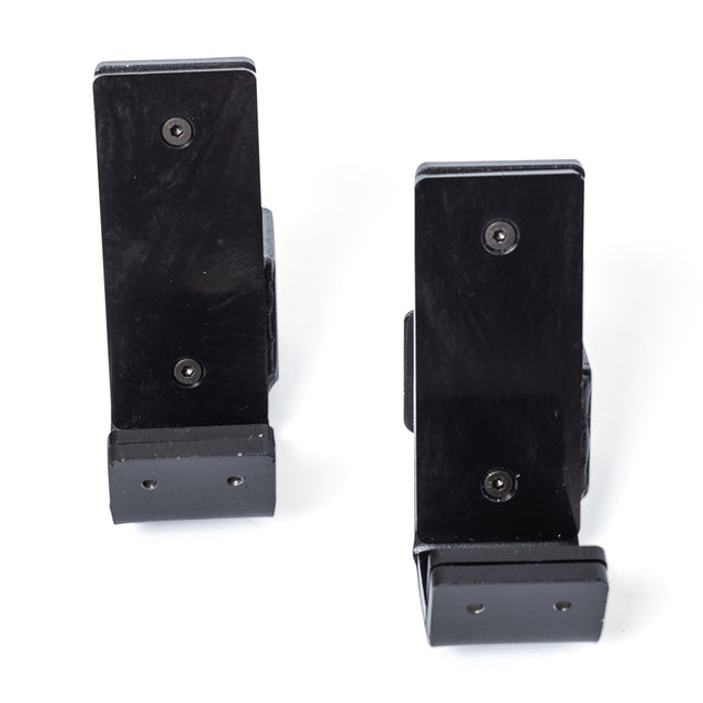 The Bells of Steel Standard J-Cups are two black metal brackets with visible screws, featuring a simple rectangular design and right-angle base for mounting to a power rack. They include UHMW protection to prevent equipment damage.