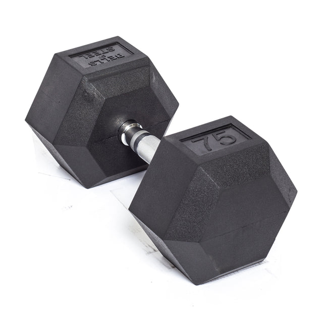 A Bells of Steel Ergo Rubber Hex Dumbbell with "75" on it, from a commercial-grade set, lies on a white surface. It features a metallic handle with textured grips.