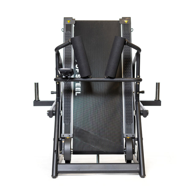 A front-facing view of The Dreadmill by Bells of Steel, a black fitness machine with padded handles and seat for exercises, featuring advanced magnetic resistance. The plain white background highlights the cardio unit's structure and parts.