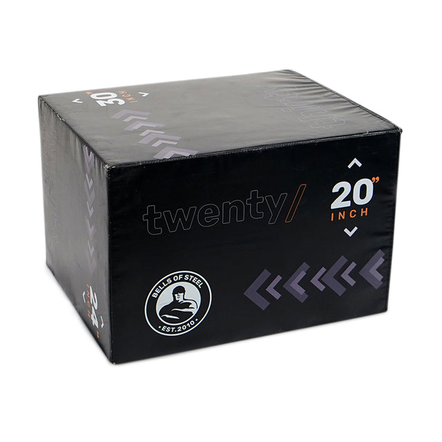 The Bells of Steel 6-In-1 Soft Foam Plyo Box / Squat Box is a black rectangular box marked "twenty // 20 inch" with purple arrows and the "Bells of Steel" logo—space-saving and versatile for various exercises.