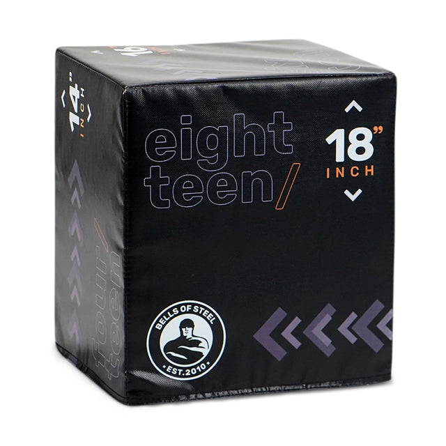 The Bells of Steel 6-In-1 Soft Foam Plyo Box is a black squat box with "eighteen," "18 inch," and the brand logo printed on the side, featuring space-saving design, versatile exercise use, and extra height measurement markings.