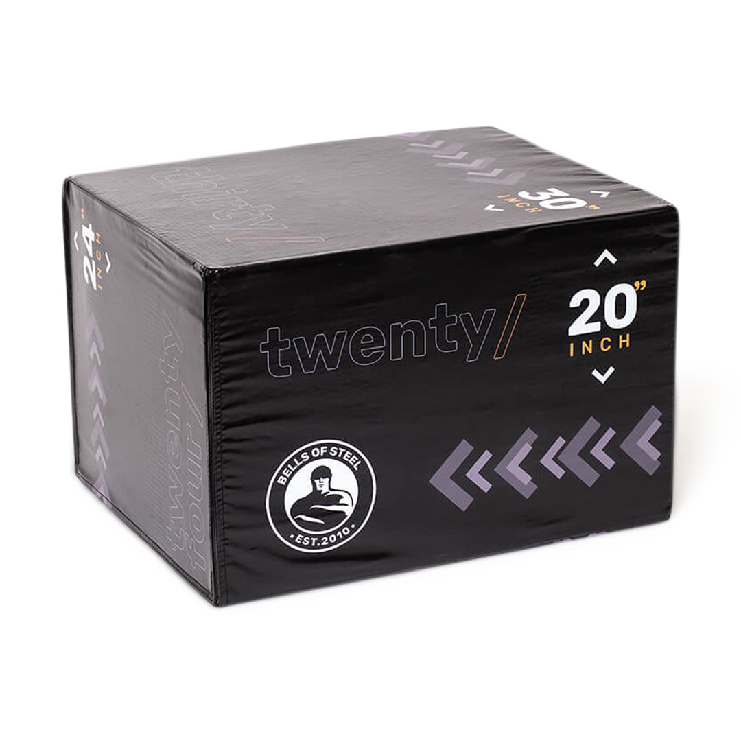 The Bells of Steel 6-In-1 Soft Foam Plyo Box / Squat Box is black with "twenty/" and "20 inch," features a circular logo and white right arrows, maximizing space efficiency for versatile workouts in any gym.