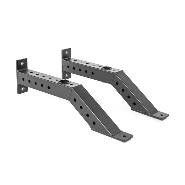 Two black metal Front Foot Stabilizers by Bells of Steel, featuring multiple evenly spaced holes and an angled design for mounting on a wall or power rack—perfect for barbell storage and organization.