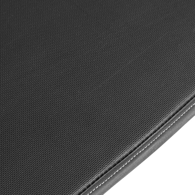Close-up of a textured black fabric surface with fine edge stitching, photographed at an angle—ideal for the Bells of Steel Flat / Incline / Decline Weight Bench - Commercial.