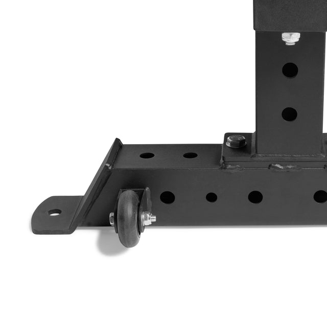 A close-up of a black metal bracket with multiple holes and a small wheel for mobility—part of the Bells of Steel Powerlifting Flat Bench, built tough to support up to 1,000lbs.