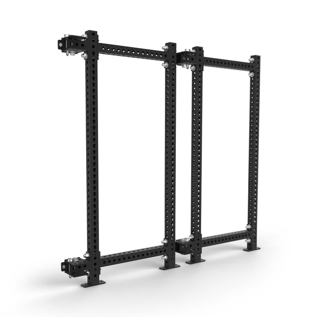 The Bells of Steel Manticore Folding Power Rack - Prebuilt (3" x 3", 1" Holes) is a black, free-standing modular rack with two perforated steel uprights and four sturdy base plates—perfect for any home gym.