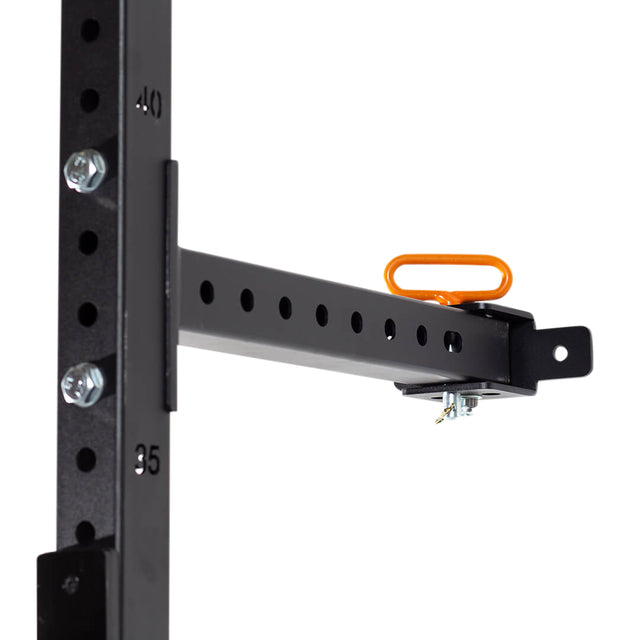 A close-up of the Bells of Steel Folding Rack 2.3" x 2.3" (5/8" Holes) with numbered holes and a horizontal support arm, secured by bolts and an orange locking pin—ideal for optimizing any garage gym setup.