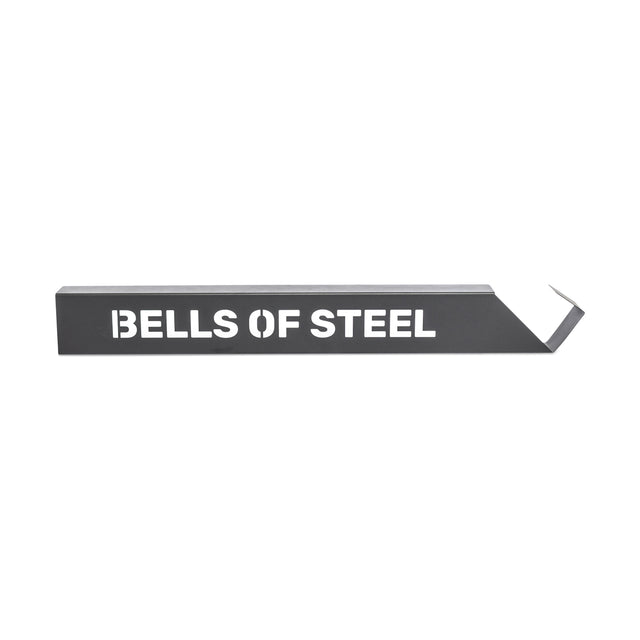 The Bells of Steel Foam Roller Storage is a black metal bar with a hooked end and "BELLS OF STEEL" in white letters, designed to mount on the wall and photographed against a white background.