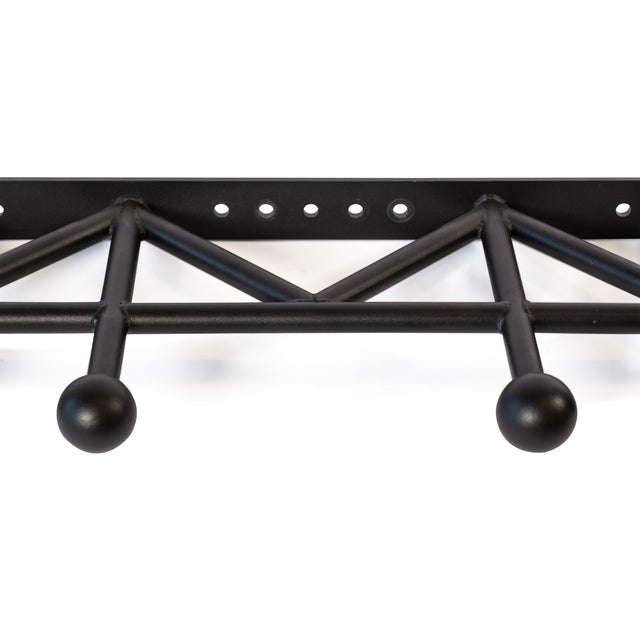 The Bells of Steel Globe Pull Up Bar is a black metal, wall-mounted rack featuring a geometric triangular support and three rounded hooks. Inspired by pull-up bar engineering, it has a sturdy build with evenly spaced holes for mounting.