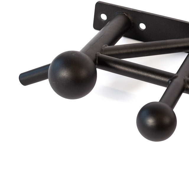 Close-up of a black metal wall-mounted hook rack with two spherical ends, resembling the Bells of Steel Globe Pull Up Bar, and one cylindrical hook, displayed against a white background.